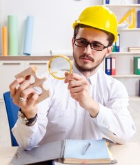 Young male architect working in the office