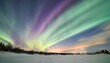 magical winter night with green and purple northern lights low angle view highlights celestial display against snowy landscape enhanced by a defocused aura made with generative ai technology