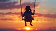 © Rattanathip - A little girl is swinging on a swing in the evening. The sky is orange and the sun is setting