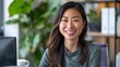 © ChaoticMind - A radiant woman with long hair smiles warmly at the camera in a casual setting with a coffee cup visible