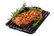 Pork steak with spices isolated on a white or transparent background. Grilled pork chop, beef steak on the grill close-up, side view.