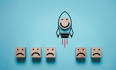 Poster - Smile face icon inside rocket missile rising from sad face icon for customer excellent experience evaluation feedback and survey concept.