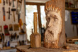  wood carving of wood spirit sculpture with mallet and chisel
