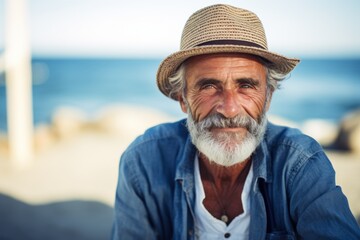 Wall Mural - An elderly man enjoys a peaceful day sitting in a chair on the seashore. Generative AI.