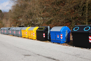 Wall Mural - waste and recyclable material bins on the roadside in a city