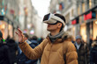 © Arsenii - A man wearing VR headset, uses gesture control for augmented reality applications on a lively street. Spatial computing and AR technology concept
