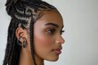 © Photo Designer 4k - Stunning African American woman with box braids in profile isolated on white background