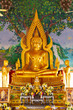 Golden Buddha Statue in a Thai Temple on Festive Day