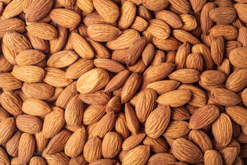 Close up of almond nuts background. Top view.