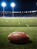 Fototapeta Sport - American football on green grass, on dark background. Team sport concept