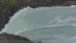 Slow Motion Close-up of Turquoise Glacial Waterfall in Rain