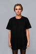 Woman wearing oversized black  t-shirt for your mockup
