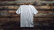 white blank t - shirt  on a wooden background