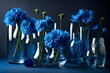 A series of delicate glass vases holding vibrant blue flowers, creating a captivating contrast against the dark blue background