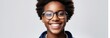 Portrait of smiling African American teenager wearing optical glasses on white background with space for text