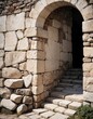 Photographic image of an ancient stone archway, expertly crafted from individual stones, leading to an unknown destination