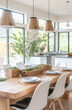 modern dining room with white chairs and a wood table, green plants in a wooden box on the side of the kitchen island, windows behind it with natural light coming through, and pendant lights.