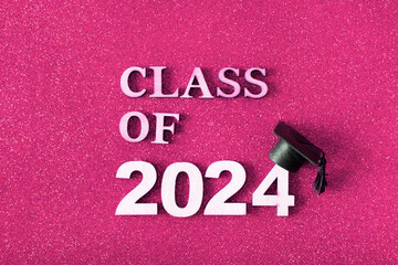 Wall Mural - Class of 2024 text with graduated cap. Graduation holiday concept.