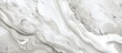 A closeup of a grey marble texture on a monochrome background, resembling waves of rock. An artistic pattern in liquid form with a peach undertone