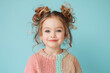 Portrait of an adorable little girl in pink sweater, blonde hair, smile to the camera
