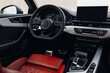 Modern expensive car interior with leather panel, sport seats, multimedia and digital dashboard