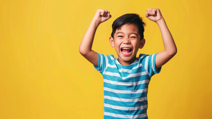 Wall Mural - an asian boy with his hands in the air