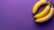 A bunch of bananas on a purple background. An exotic fruit. Delicious and juicy bright yellow bananas.