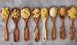 wooden spoons with different pasta seen from above on kitchen table top wallpaper	