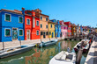Colorful houses in a canal street houses of Burano island, Venice, Italy