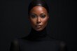 © Adobe Contributor - A portrait of a beautiful black woman wearing a black turtleneck sweater.