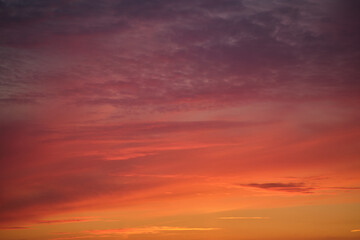 Wall Mural - The sunset sky was filled with a mix of red and orange clouds
