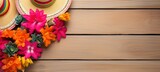 Fototapeta Pokój dzieciecy - Cinco de Mayo wooden background with sombrero and colorful flowers