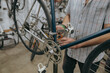 Close up of bicycle mechanic in workshop in the repair process. High quality photo