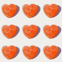 Wall Mural - Seamless pattern with marmalade in the form of heart on white background.