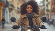 Positive African American woman on an electric bicycle in a city