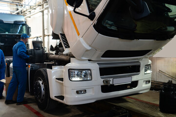Poster - Truck repair service indoors. Maintenance workshop