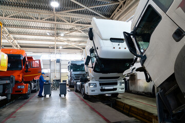 Sticker - Truck repair service indoors. Maintenance workshop.