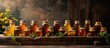 Several bottles of honey in various shapes and sizes are neatly arranged on a wooden table.