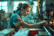 Focused woman operating machinery on factory floor.