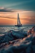 A sailboat sailing in the middle of the ocean at sunset. Perfect for travel and adventure concepts