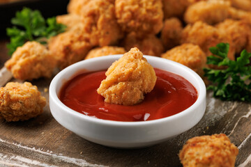 Wall Mural - Crispy Popcorn Chicken with ketchup sauce on wooden board