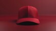 A red baseball cap on a red surface. Suitable for sports and fashion concepts