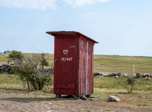 Red Wooden Outhouse