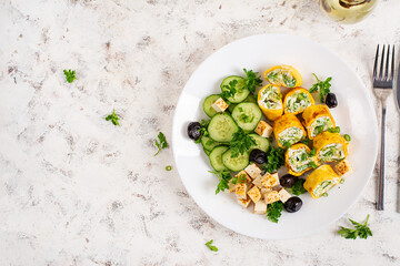 Wall Mural - Healthy breakfast. Roll omelette, feta cheese and cucumber salad. Keto, ketogenic lunch. Top view