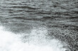 Black and white abstract background top view surface ocean wave splash creating white air foam bubble on left corner leaving negative space	