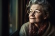 Elderly Woman Gazing Out Window in Contemplation. Generative AI