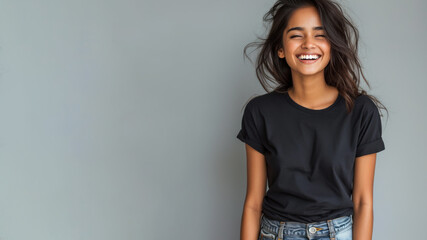 Wall Mural - Indian young woman wear black t-shirt smile isolated on grey background