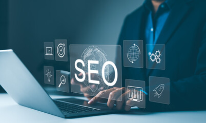 Wall Mural - SEO strategy tools and optimization concepts. Marketer working on SEO strategy with laptop and virtual screen showing global SEO optimization icons. attract organic traffic, digital marketing, search,