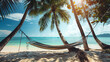 A hammock strung between two palm trees on a sandy beach.