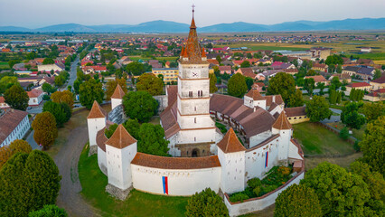 Sticker - Sunset view of the Fortified Evangelical Church in Harman, Romania